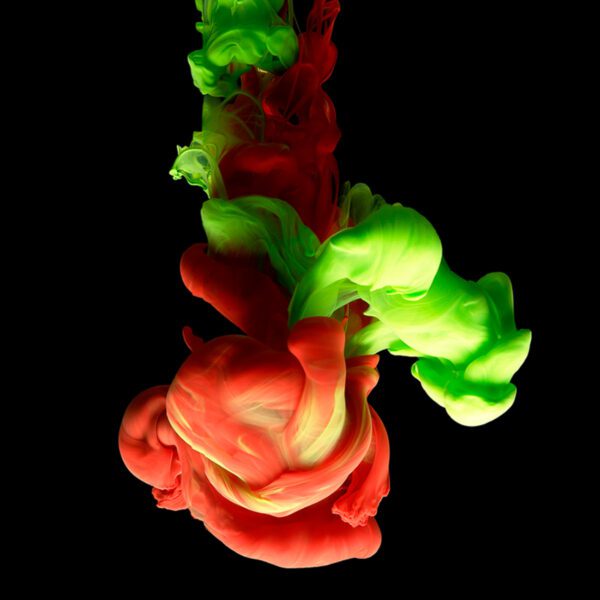 colored ink on bleed black background