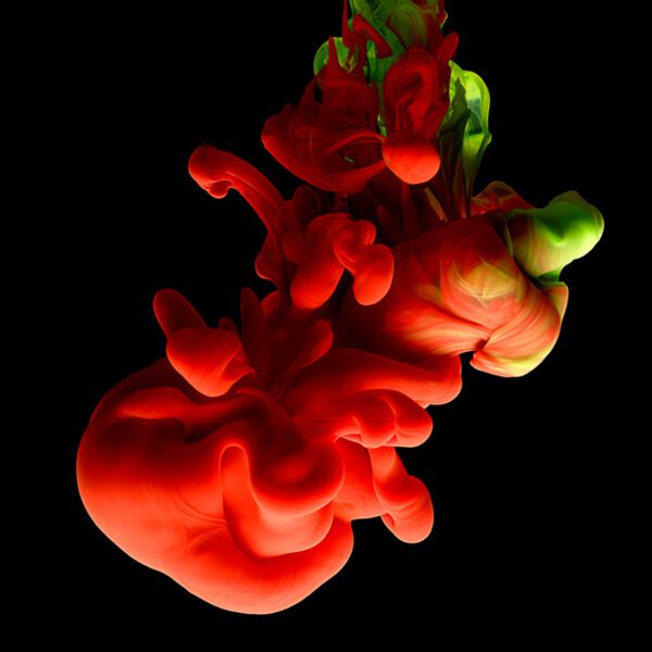 colored ink on black background