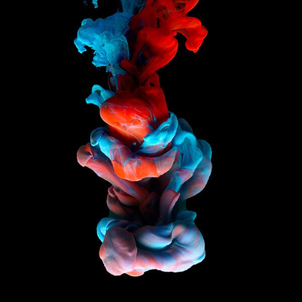 colored ink on black background